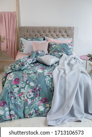 Colorful Pillows, Duvet And Duvet Case On A Bed. Beautiful Bed Linen On A Sofa. Bedroom With Bed And Bedding. Messy Bed. Front View.