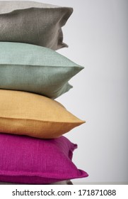 Colorful pillows stack isolated on white