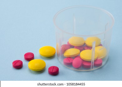 Colorful Pills In Dosage Cup