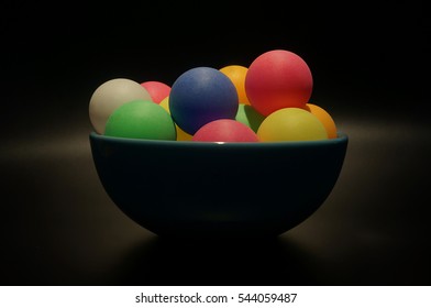  Colorful ping pong balls in a bowl - Powered by Shutterstock