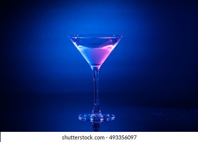 Colorful Pink Cocktail In Martini Glass On Background At Party. Selective Focus.