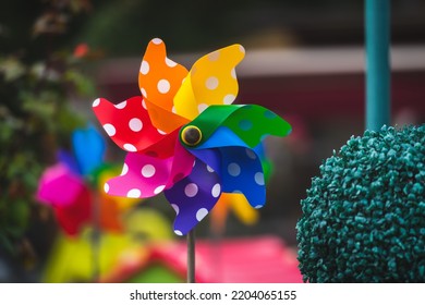 Colorful Pinwheel Toys In A Garden