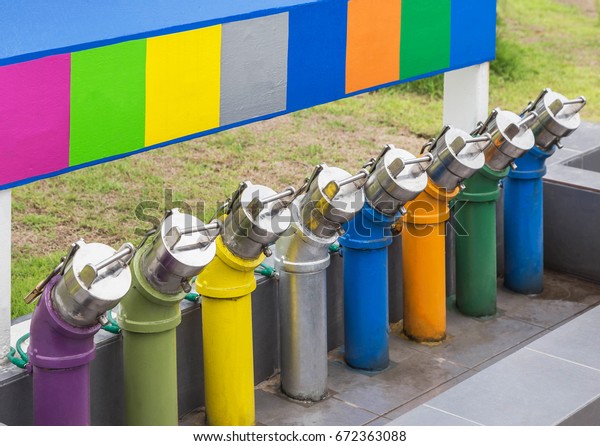 colorful of pipeline fuel\
for transmission oil to underground fuel storage tanks in gas\
service station