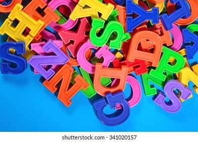 Colorful Plastic Alphabet Letters On Blue Stock Photo (Edit Now) 341020175