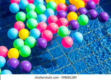 Colorful plastic balls in pool , pool villa house.