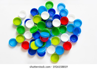 Colorful Plastic Caps Isolated On White Background, Recycle For Environment Concept