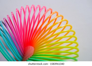 Colorful Plastic Coil On White Background, Plastic Toy Spring