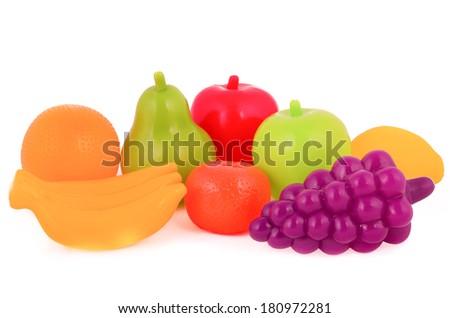 colorful plastic food over white background