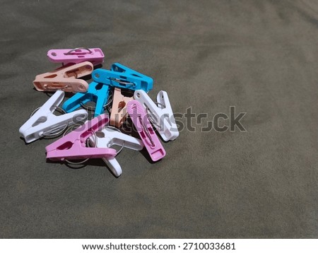 colorful plastic laundry clips stack: essential household accesory 