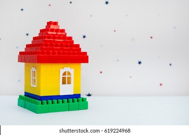 Colorful Plastic Toy House From A Designer On A Light Abstract Background