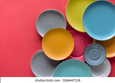 colorful plates composition on red background