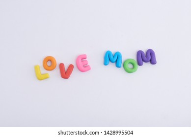 Colorful Play Doh Shaped Into Letters Love Mom Isolated On White Background