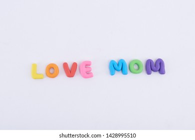 Colorful Play Doh Shaped Into Letters Love Mom Isolated On White Background