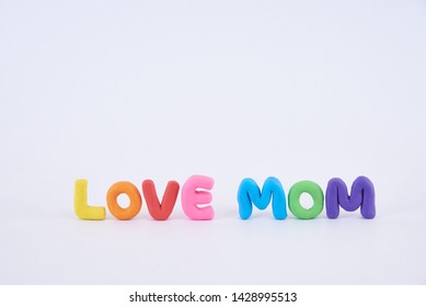 Colorful Play Doh Shaped Into Letters Love Mom Isolated On White Background