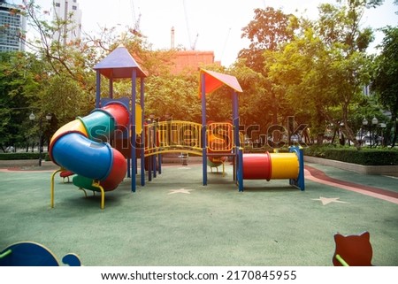 Colorful playground made of plastic empty outdoor playground set playground equipment.Garden equipment. Children's slide. School yard. Playground in the park.
