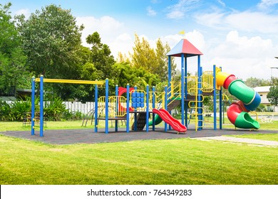 Colorful playground on yard in the park. - Shutterstock ID 764349283