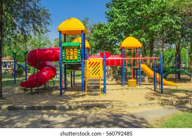 colorful playground in the park - Shutterstock ID 560792485