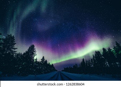 Colorful polar arctic Northern lights Aurora Borealis activity in winter Finland, Lapland