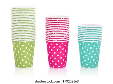 Colorful polka dot paper cups isolated on white. Clipping path included - Powered by Shutterstock