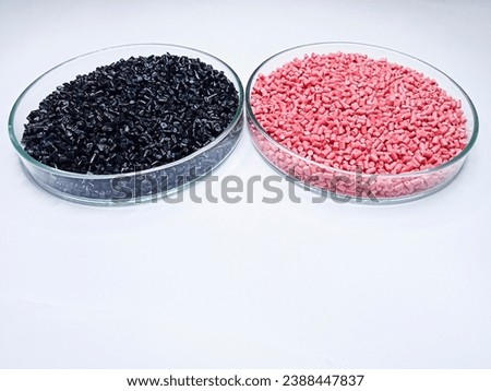 Colorful polymer masterbatch granules in a petri dish isolated on a white background suitable for corporate photo art background and banner designs