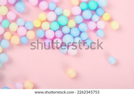 Colorful polystyrene foam on pink background, creativity concepts