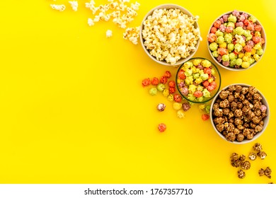 Colorful Popcorn In Bowl On Yellow Desk From Above Copy Space