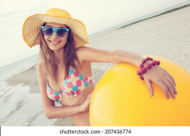 Colorful portrait of cheerful girl on the beach