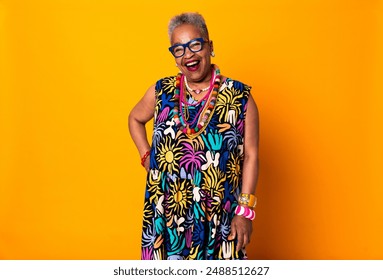 Colorful portrait of funny senior black woman wearing stylish clothing isolated in studio - Cool modern old female adult, concepts about elderly, 
 senior people and body positive - Powered by Shutterstock