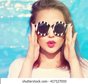 Colorful Portrait Of Young Attractive Woman Wearing Sunglasses. Summer Beauty  Concept