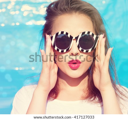 Colorful portrait of young attractive woman wearing sunglasses. Summer beauty  concept