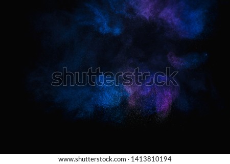 Colorful powder explosion, isolated on black background