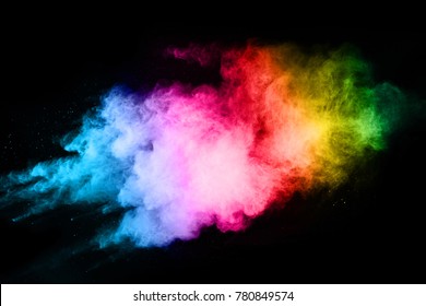 Colorful powder explosion on black background. Colored cloud. Colorful dust explode. Paint Holi.