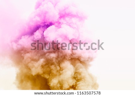 Colorful powder explosion.Colored cloud. Colorful dust explode.Paint Holi.Bomb smoke background,Smoke caused by explosions