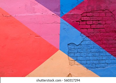 Colorful (purple, blue pink and beige) brick wall as background, texture - Shutterstock ID 560317294
