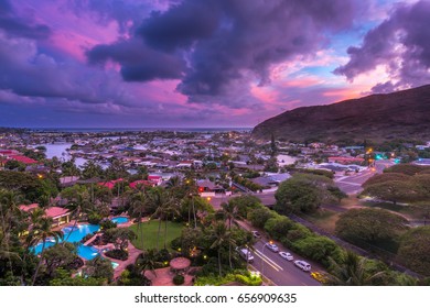 colorful purple and blue tropical hawaiian sunset near dusk over a hawaii kai marina at the foot of the koolau mountain range on the island of oahu hawaii usa