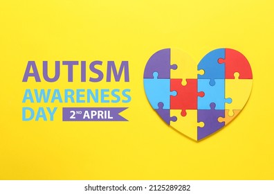 Colorful Puzzle Pieces In Shape Of Heart On Yellow Background. World Autism Awareness Day