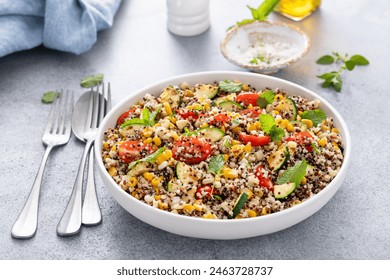 Colorful quinoa salad with mixed vegetables, perfect for a healthy meal - Powered by Shutterstock