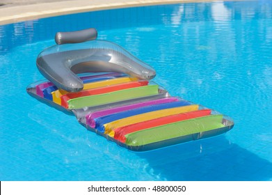 Colorful Raft Float In Swimming Pool