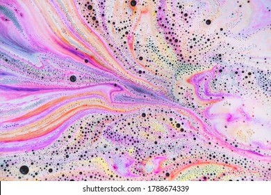 Colorful rainbow bath foam with bubbles in the water. Galaxy imagination. Marble texture effect. Beauty and luxury background. Abstract art