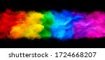 colorful rainbow holi paint color powder explosion garland banner isolated on dark black wide panorama background. peace rgb beautiful party concept