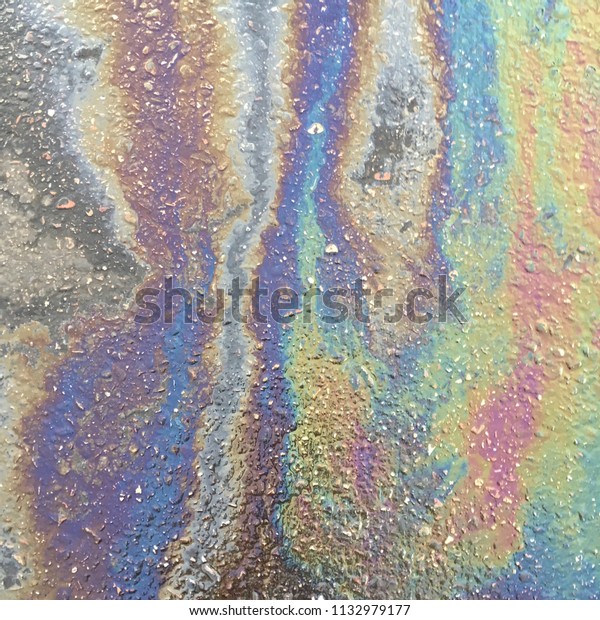 Colorful
Rainbow Oil Spot Mixed with Water in Parking
Lot