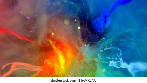 Colorful Rainbow Paint 
Threads and Drops Mixing in Water. Ink swirling. Underwater 4K Macro Shot.