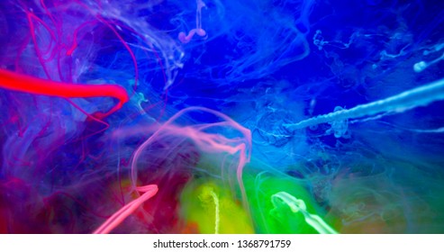 Colorful Rainbow Paint 
Threads and Drops Mixing in Water. Ink swirling. Underwater 4K Macro Shot.