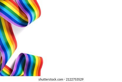 Colorful rainbow ribbon border design. LGBT colourful corner design, isolated on white background. Gay pride design. Curly, waving ribbon or banner with flag of LGBTQ pride border.