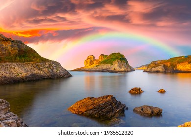 The colorful rainbow, which is born after the rain, provides a spectacular landscape. Colorful rainbow view that appears among the pink clouds. Skyline of sunrise on the beach. Kas, Antalya. - Powered by Shutterstock