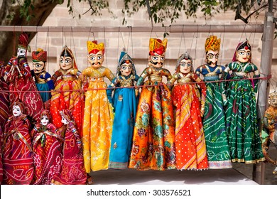 Colorful Rajasthan Puppets Hanging In The Shop Of Jodhpur City Palace, India   