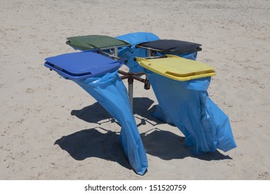 Colorful Recycle Bins on the beach. - Powered by Shutterstock