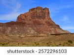 the colorful red rock  butte of  assembly hall peak  on a sunny summer day  along the buckhorn draw scenic backway in the northern san rafael swell near green river,  utah 