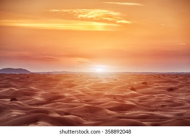Colorful red sunset over desert