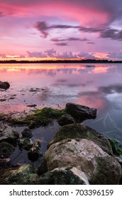 A Colorful Reflection Off Lake Baldwin At Sunset In Winter Park, FL.